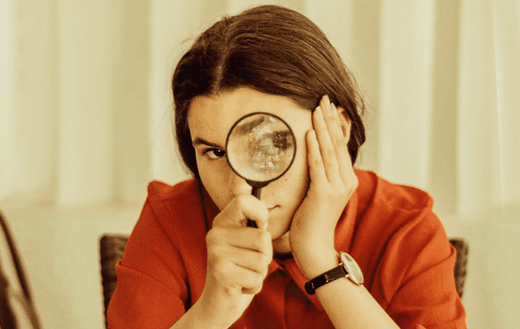 Person reviewing details closely